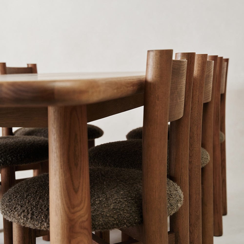 Teddy mocha dining chairs tucked under solid wood dining table