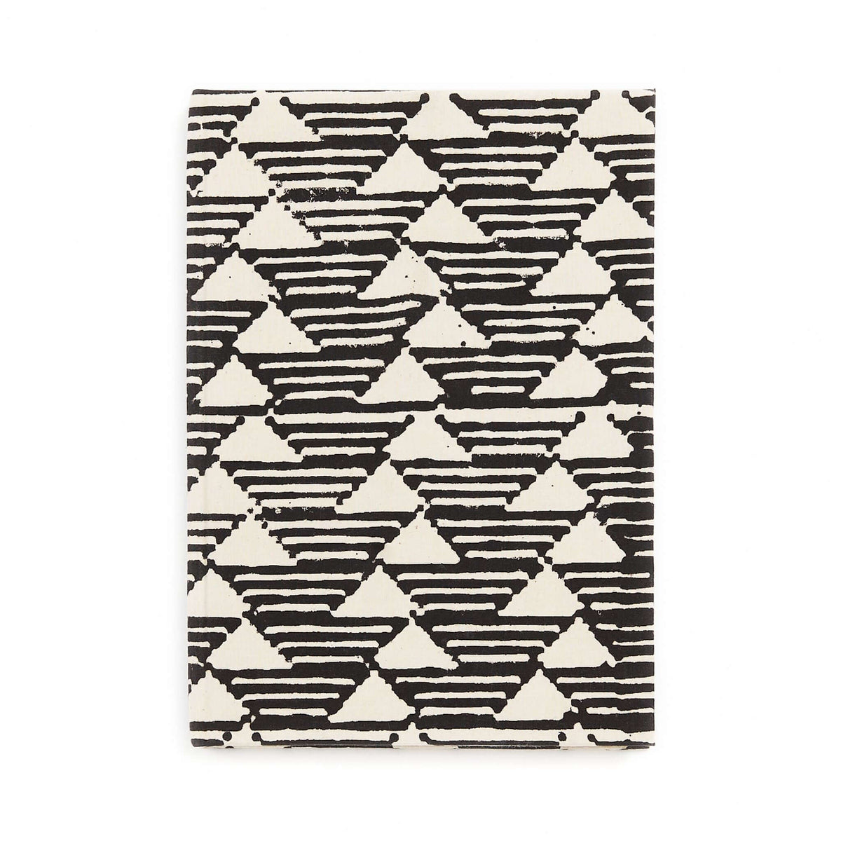 Front view of the Tria journal’s bold black-and-white cover featuring repeating striped triangles