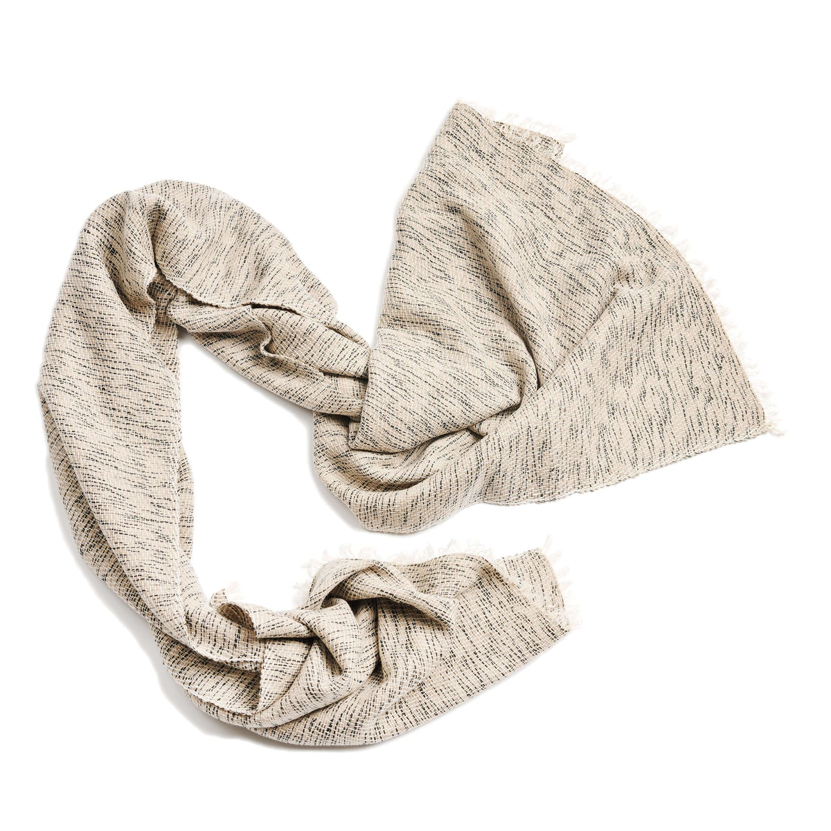Loosely arranged Forest Night scarf displaying its soft drape, textured weave, and fringed ends.