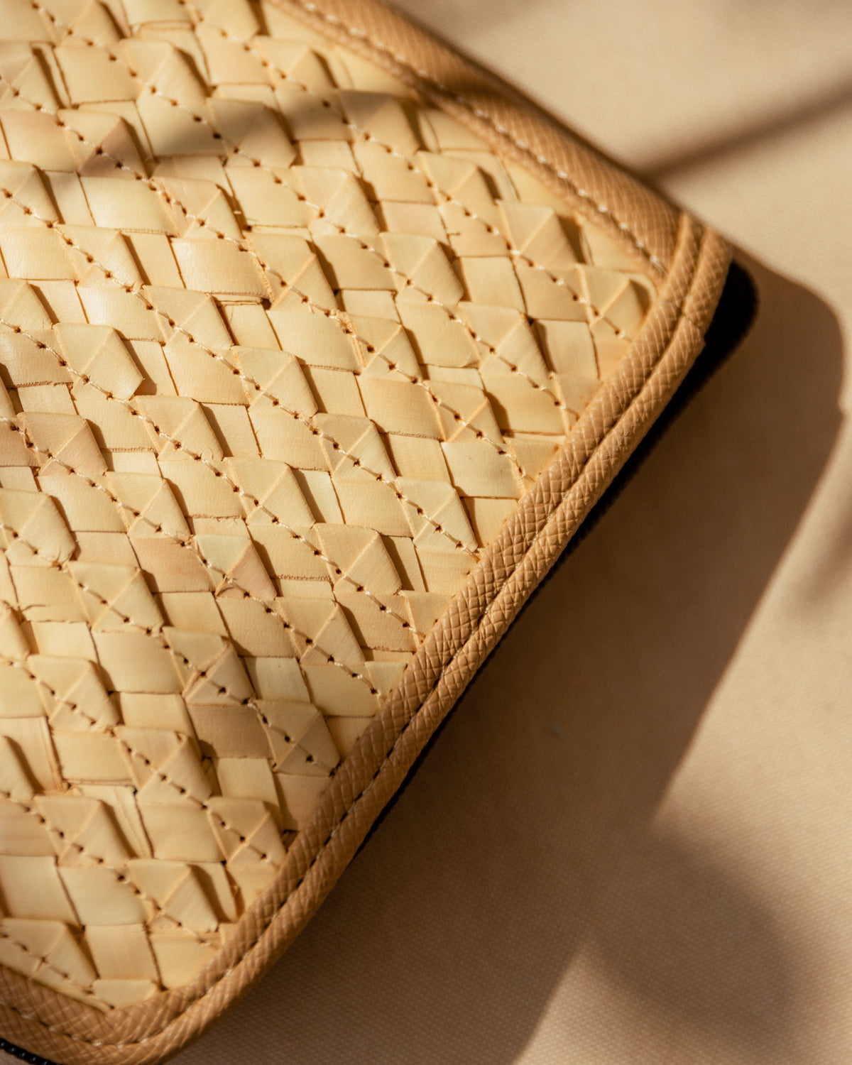 Village Thrive Rattan & Canvas Compact Eco Tote Bag, natural rattan cane, close-up angled view.