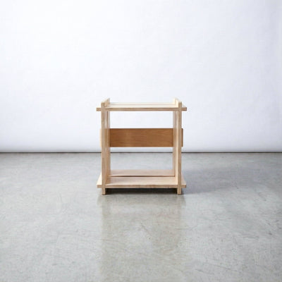 Straight-on view of an empty Williamsburg Cubical natural wood storage unit against a plain studio background