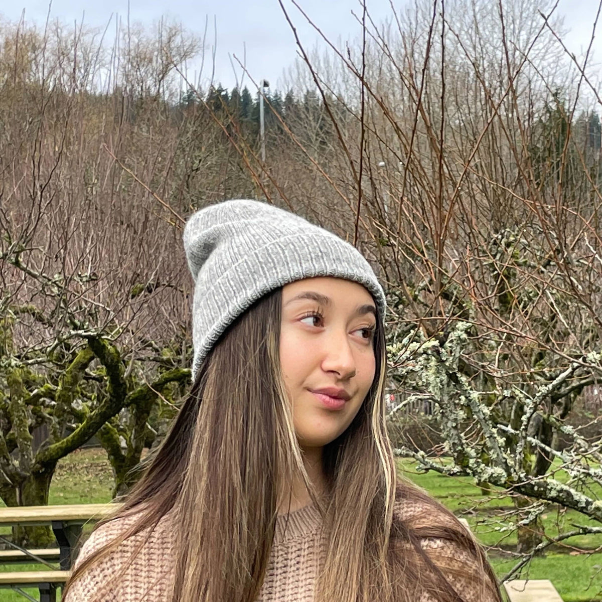 Recycled Wool-Blend Japanese Knit Beanie in Light Gray on woman in Park
