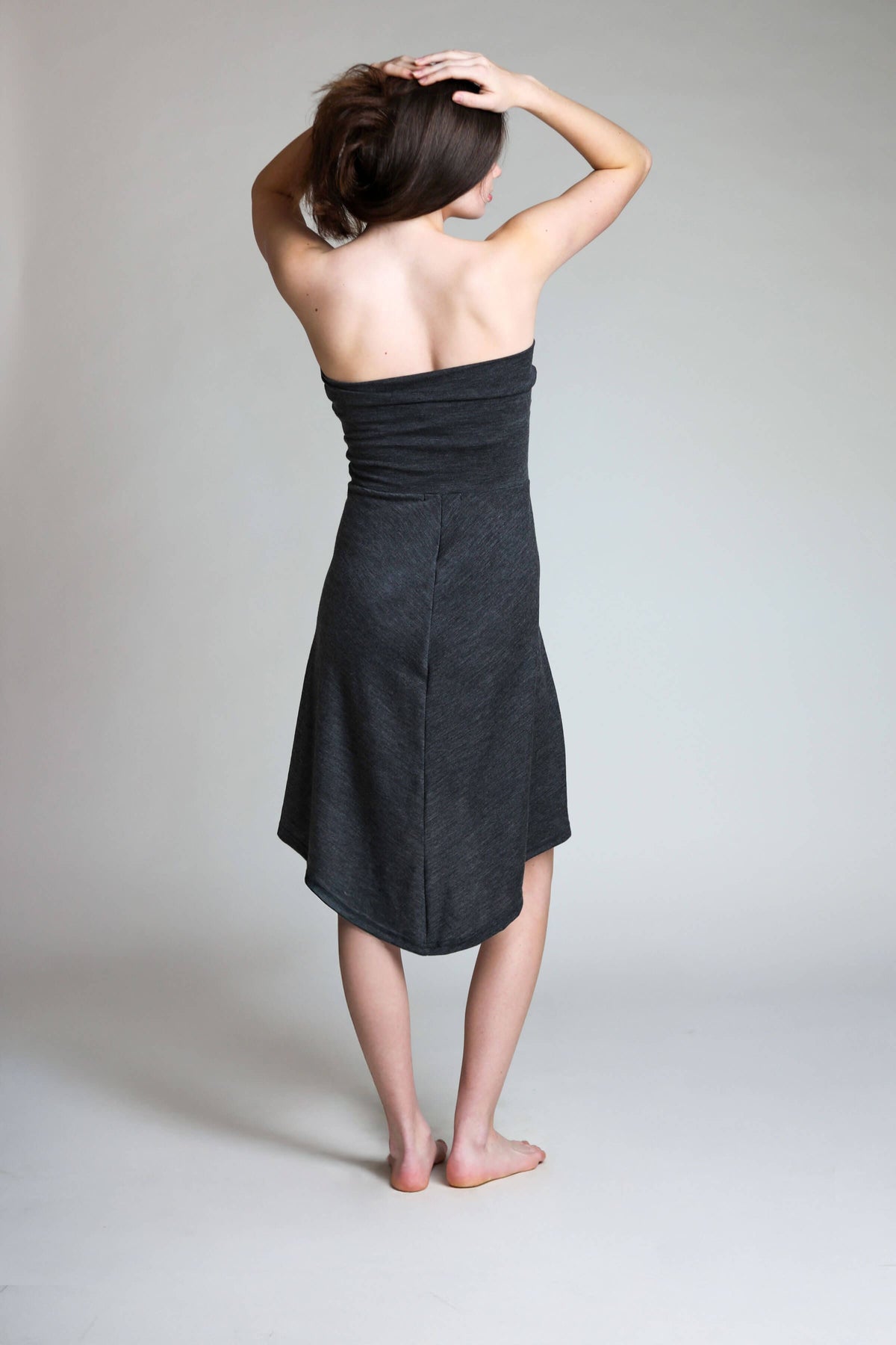 Back view of a strapless merino wool dress designed for sauna recovery, travel, and everyday wear.
