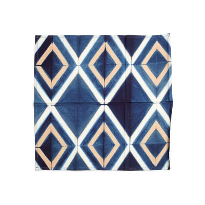 Blue color variation of the Tisa napkin with cream and tan geometric diamonds.