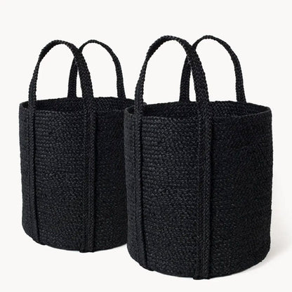 Two black jute baskets with handles, one small and one large, against a white background.